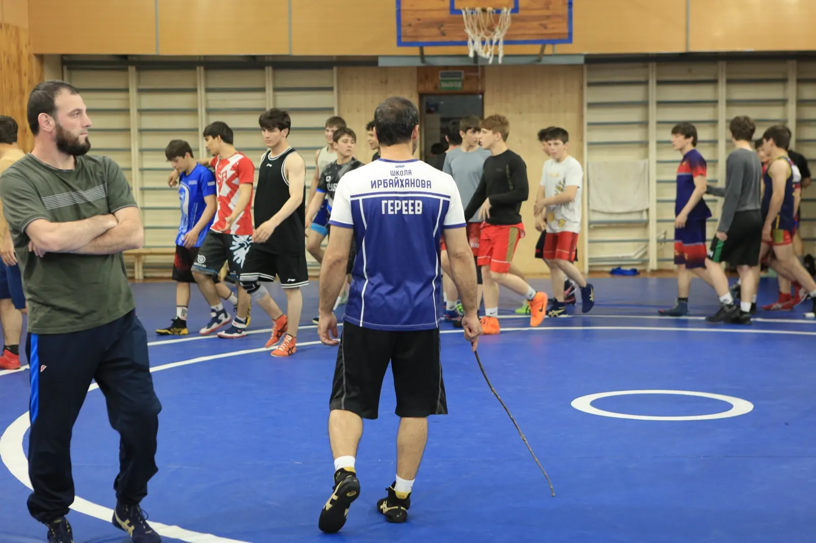 Dagestani wrestling coach making a technical correction