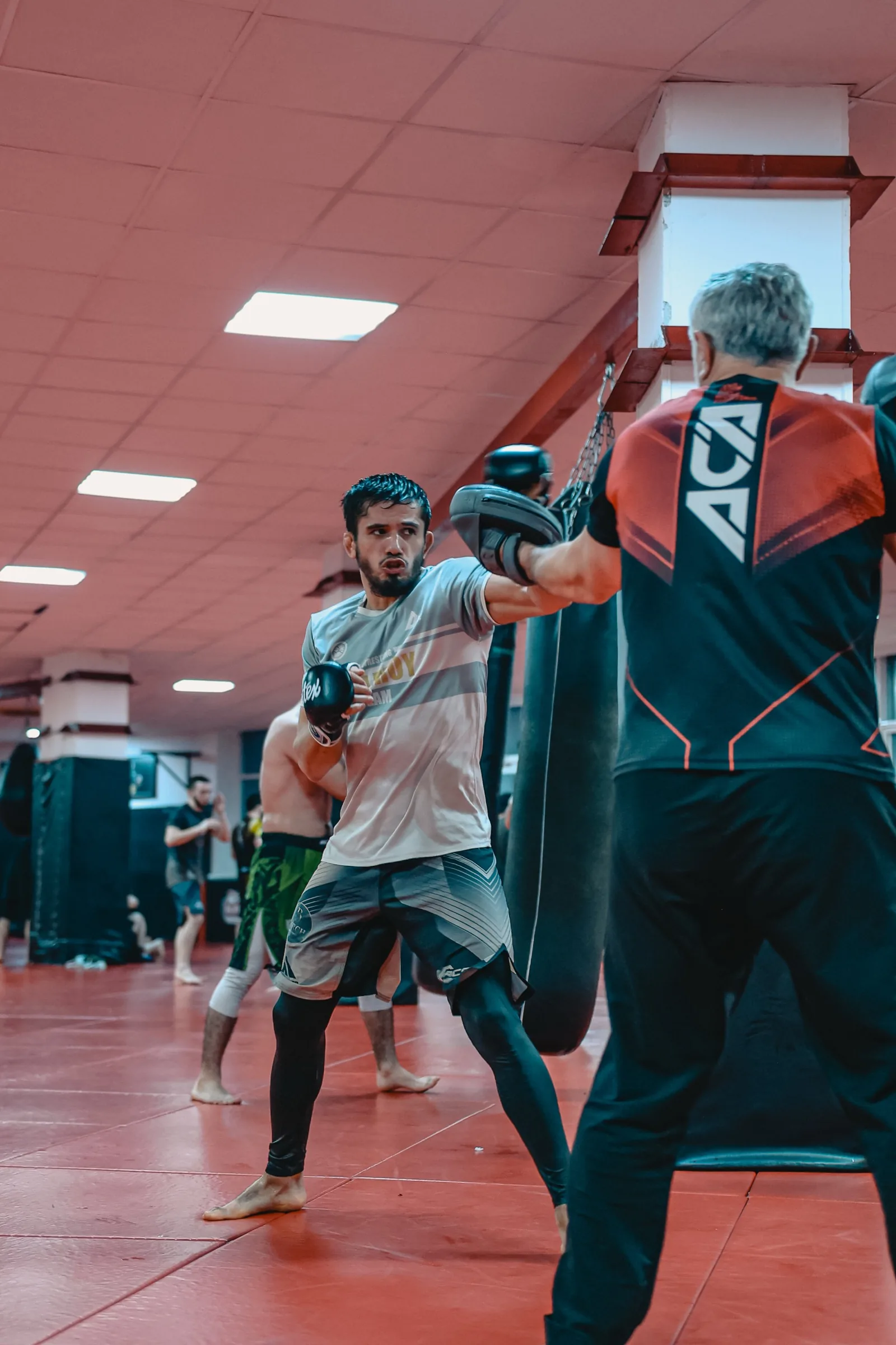 Low kick thrown in training inside the cage of the Grozny club